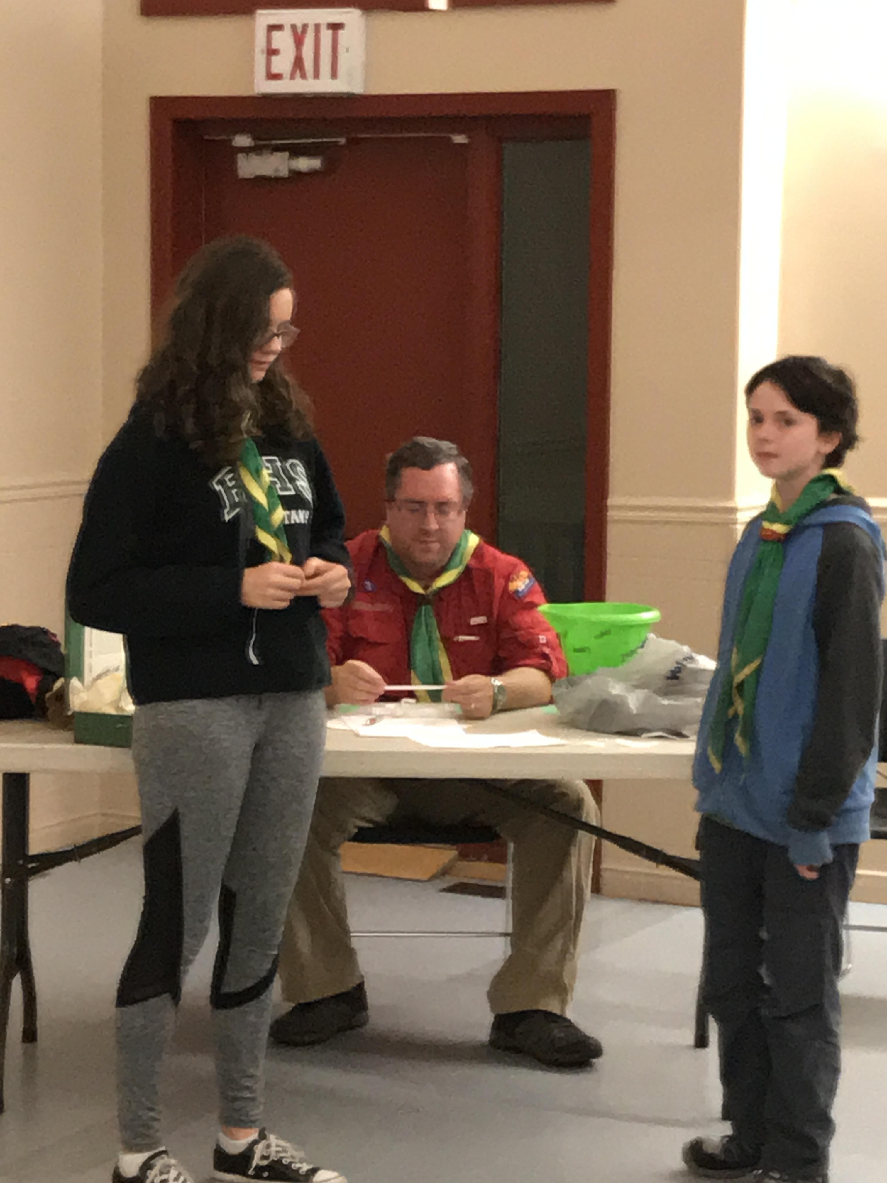 Scouts teaching each other about first aid Playing the first aid game